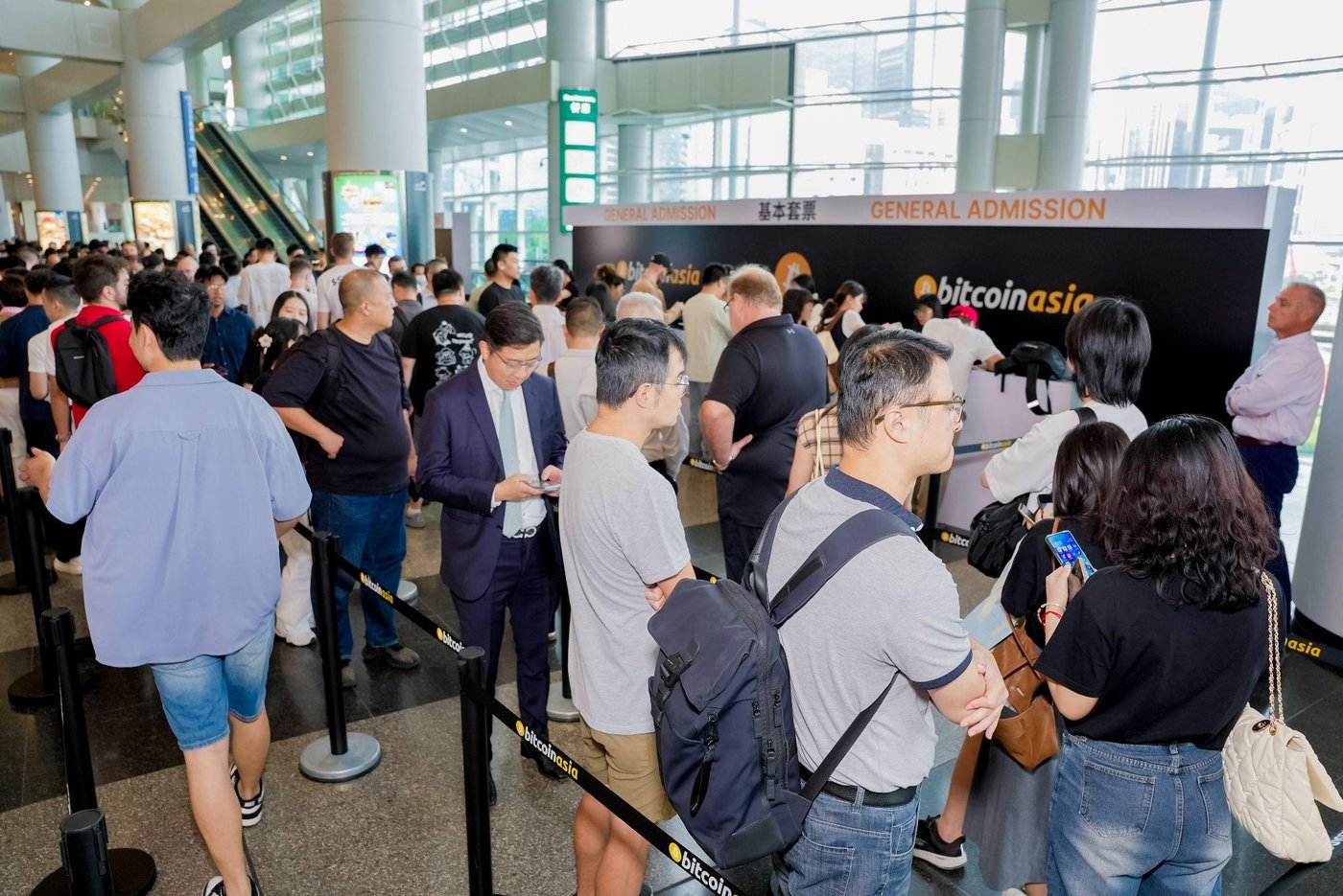 Attendees queueing at general admission.